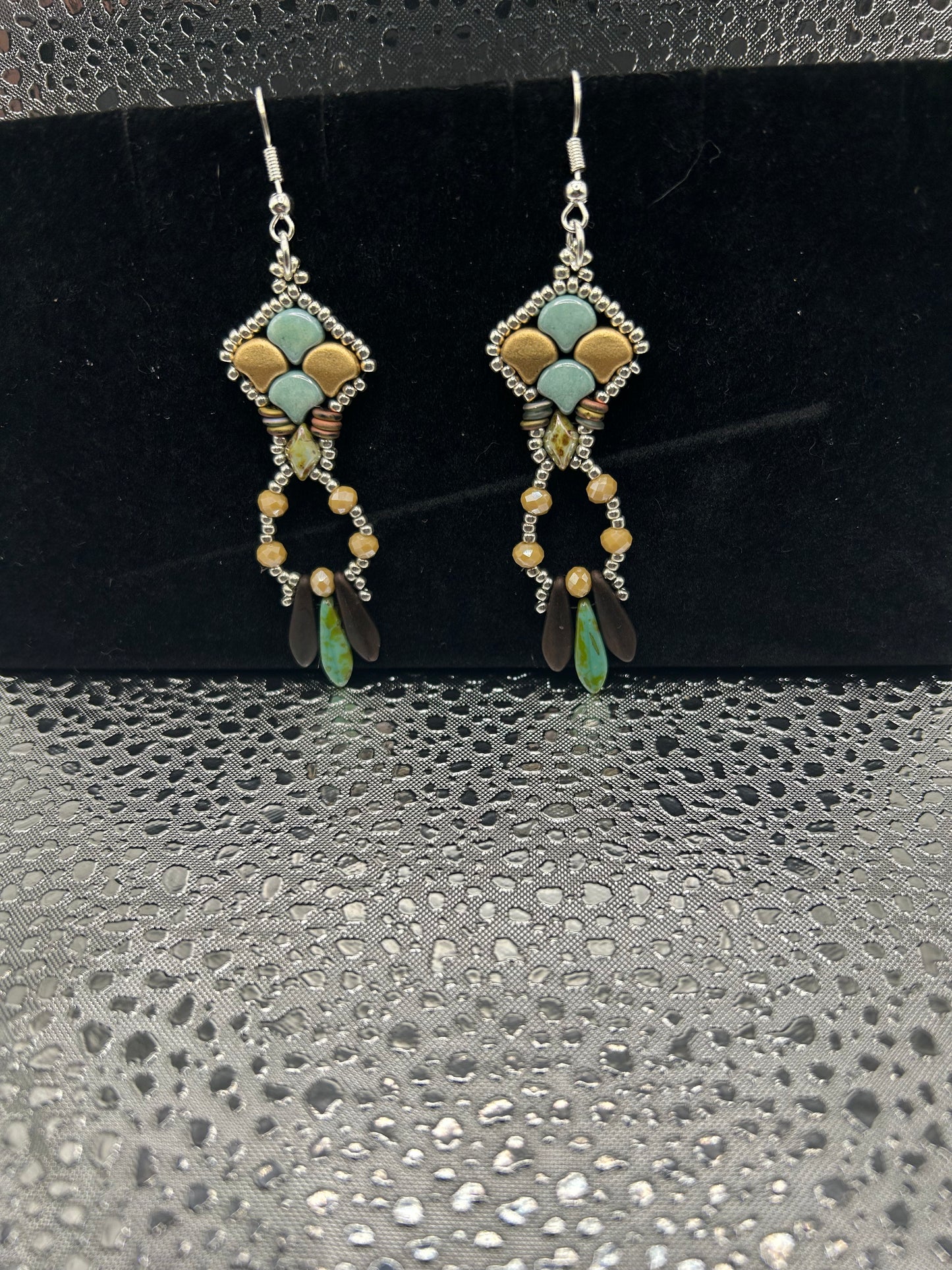 Earrings dangling different colors