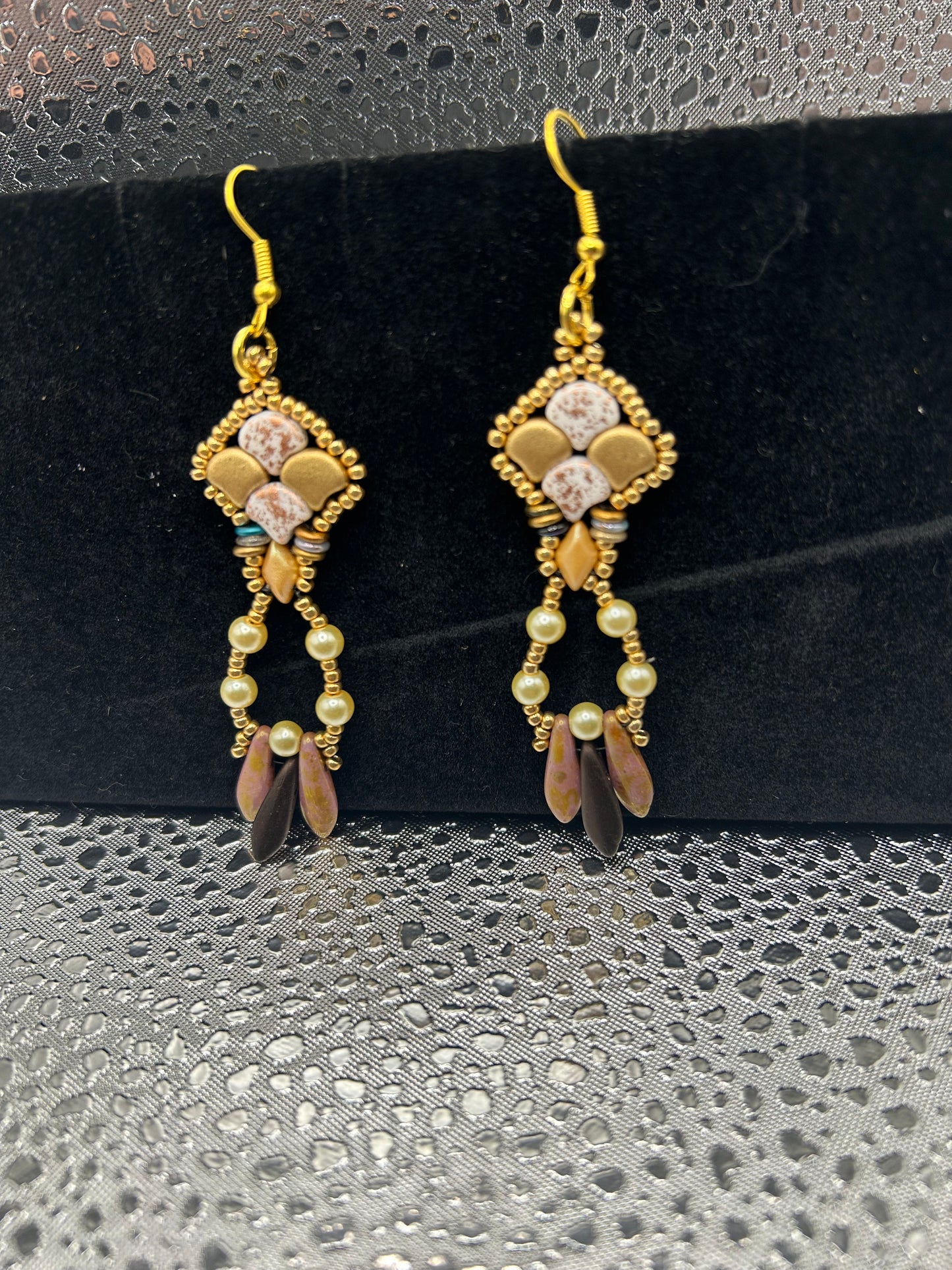 Earrings dangling different colors