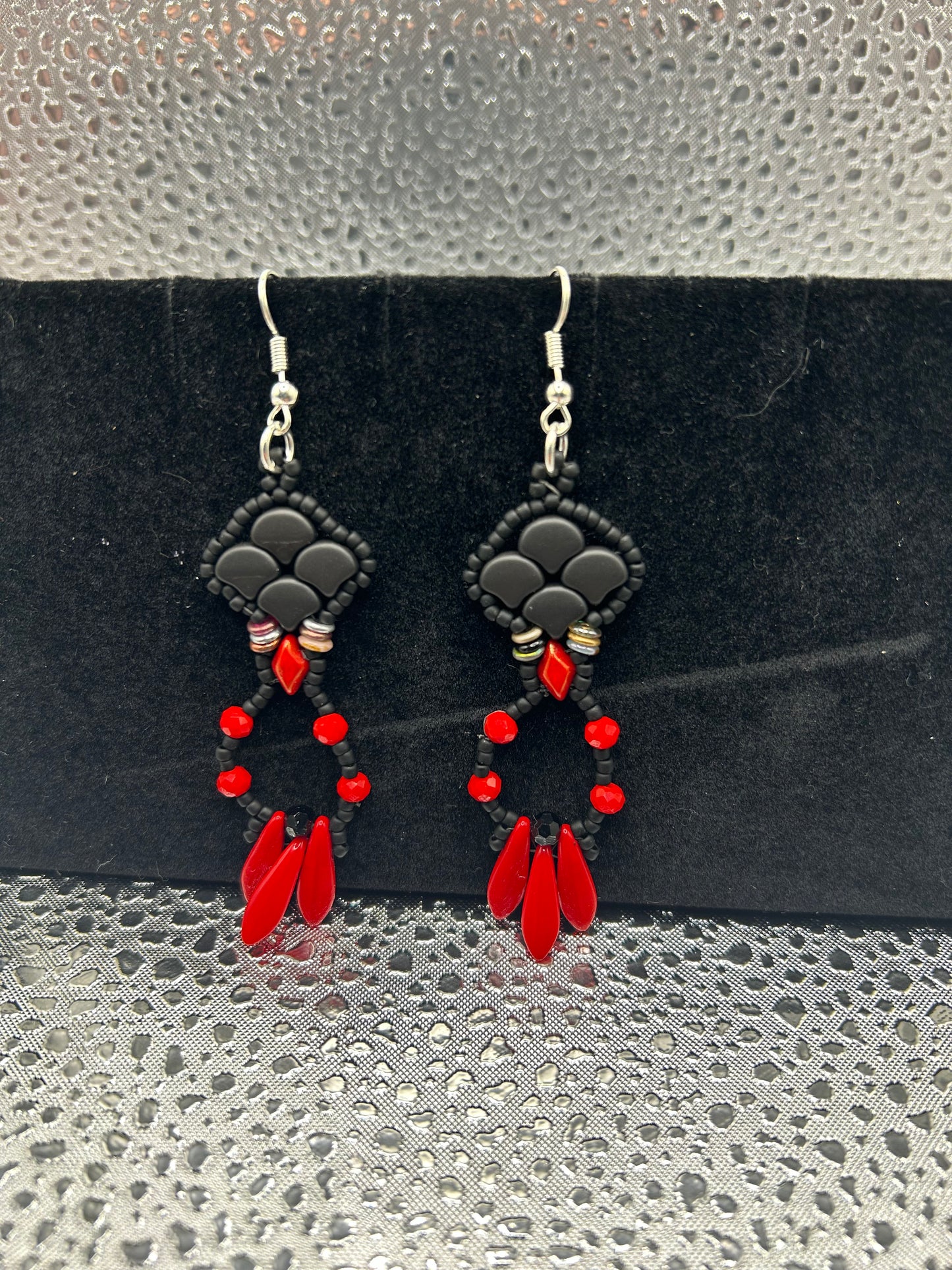 Earrings dangling different colors